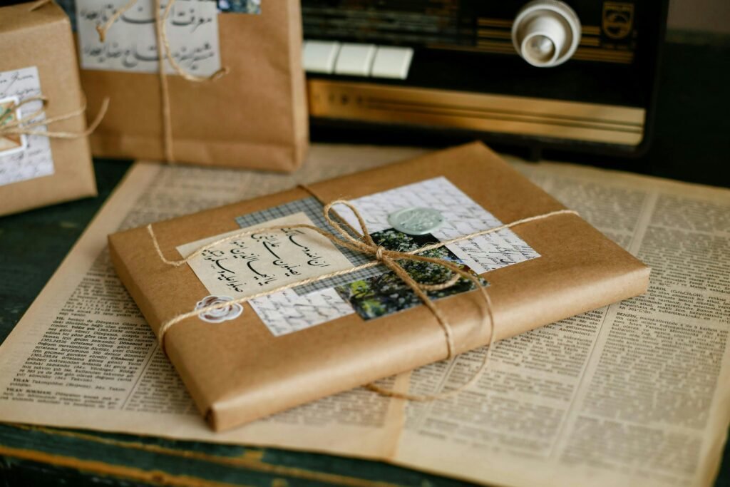 Beautifully wrapped gifts in kraft paper on vintage book pages